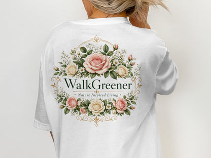 White t-shirt with a floral wreath logo that says "WalkGreener Nature Inspired Living."