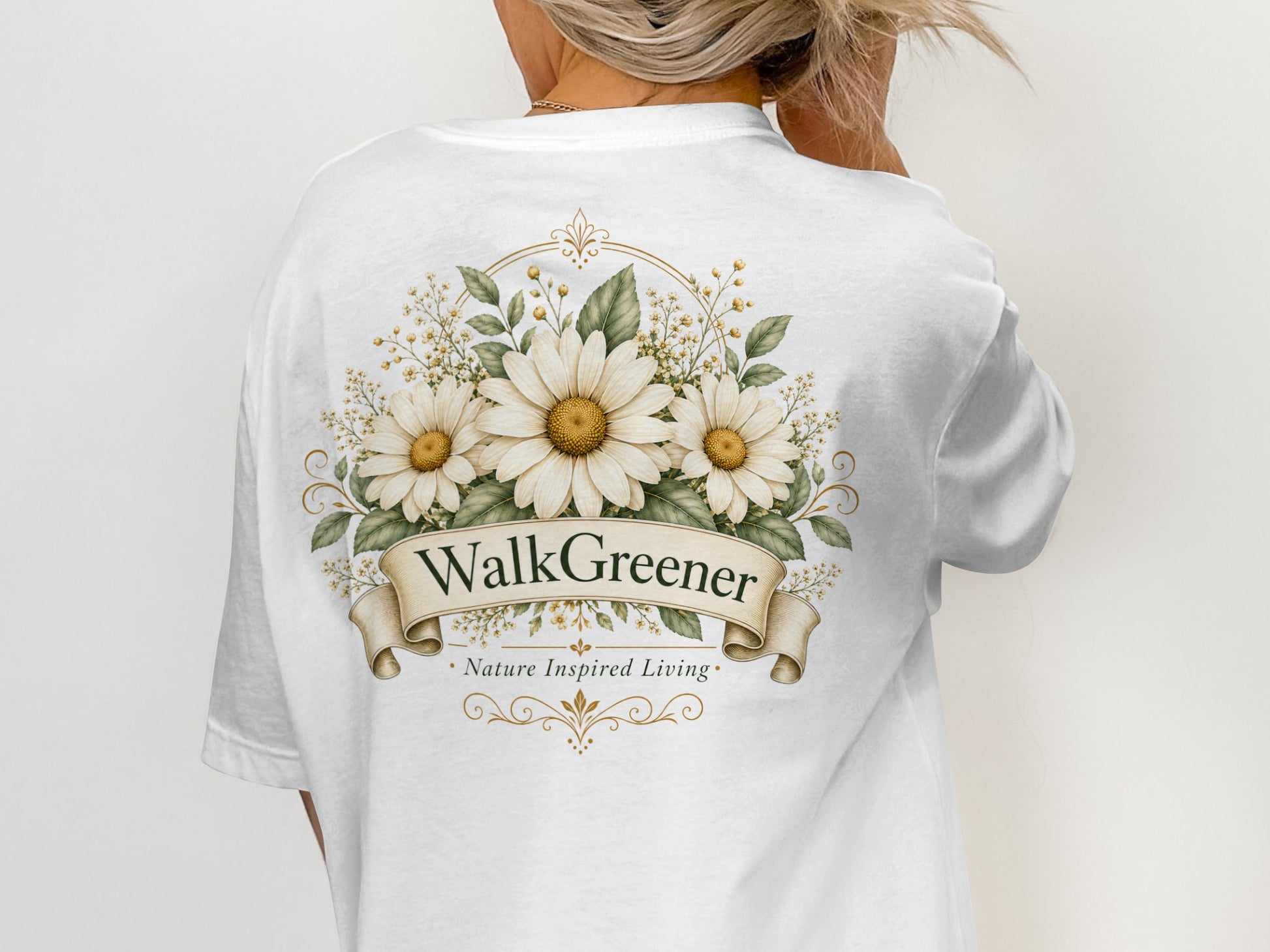 White t-shirt with "WalkGreener Nature Inspired Living" floral logo on back.