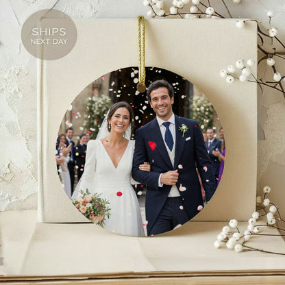 Newlyweds walk arm-in-arm with confetti falling, smiling.