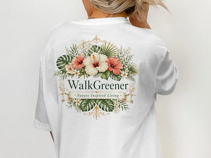White t-shirt with floral design and text "WalkGreener. Nature Inspired Living."
