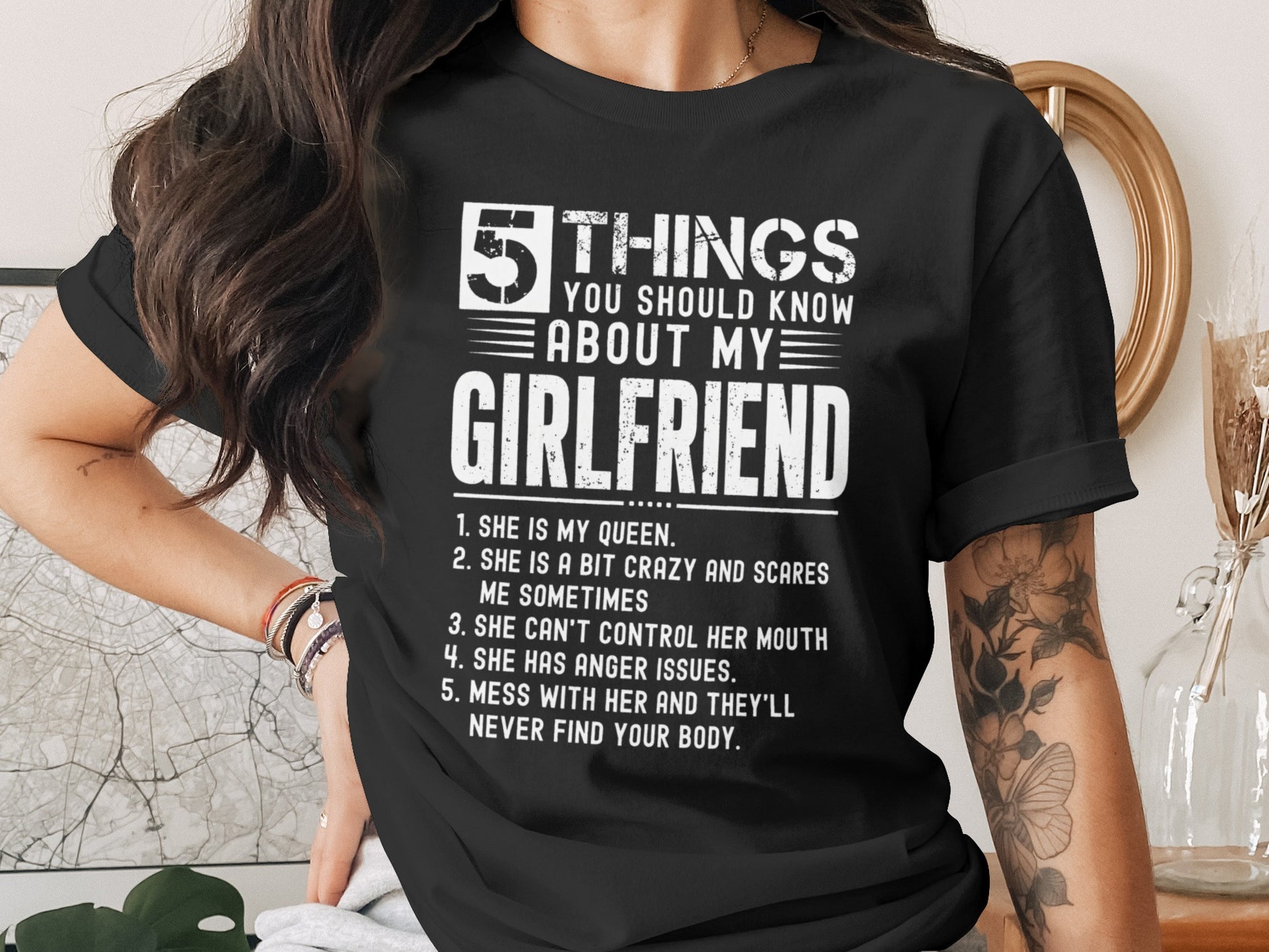 Black t-shirt with white text listing five things about a girlfriend.