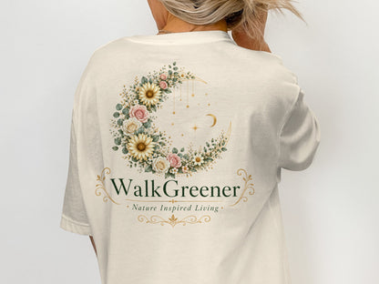 Cream t-shirt with floral crescent moon design and "WalkGreener Nature Inspired Living" text.