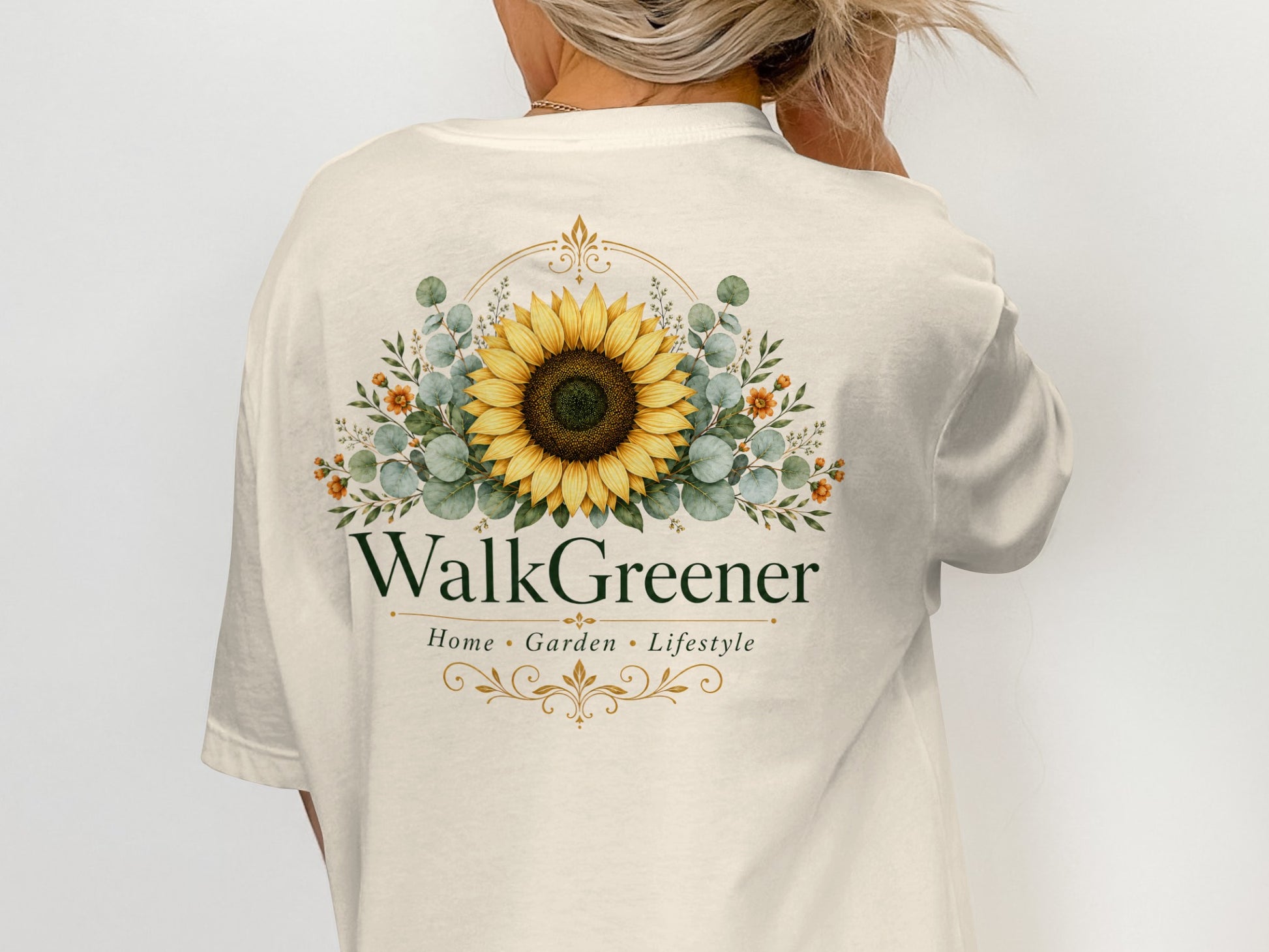Cream t-shirt with WalkGreener logo featuring a sunflower and floral wreath.