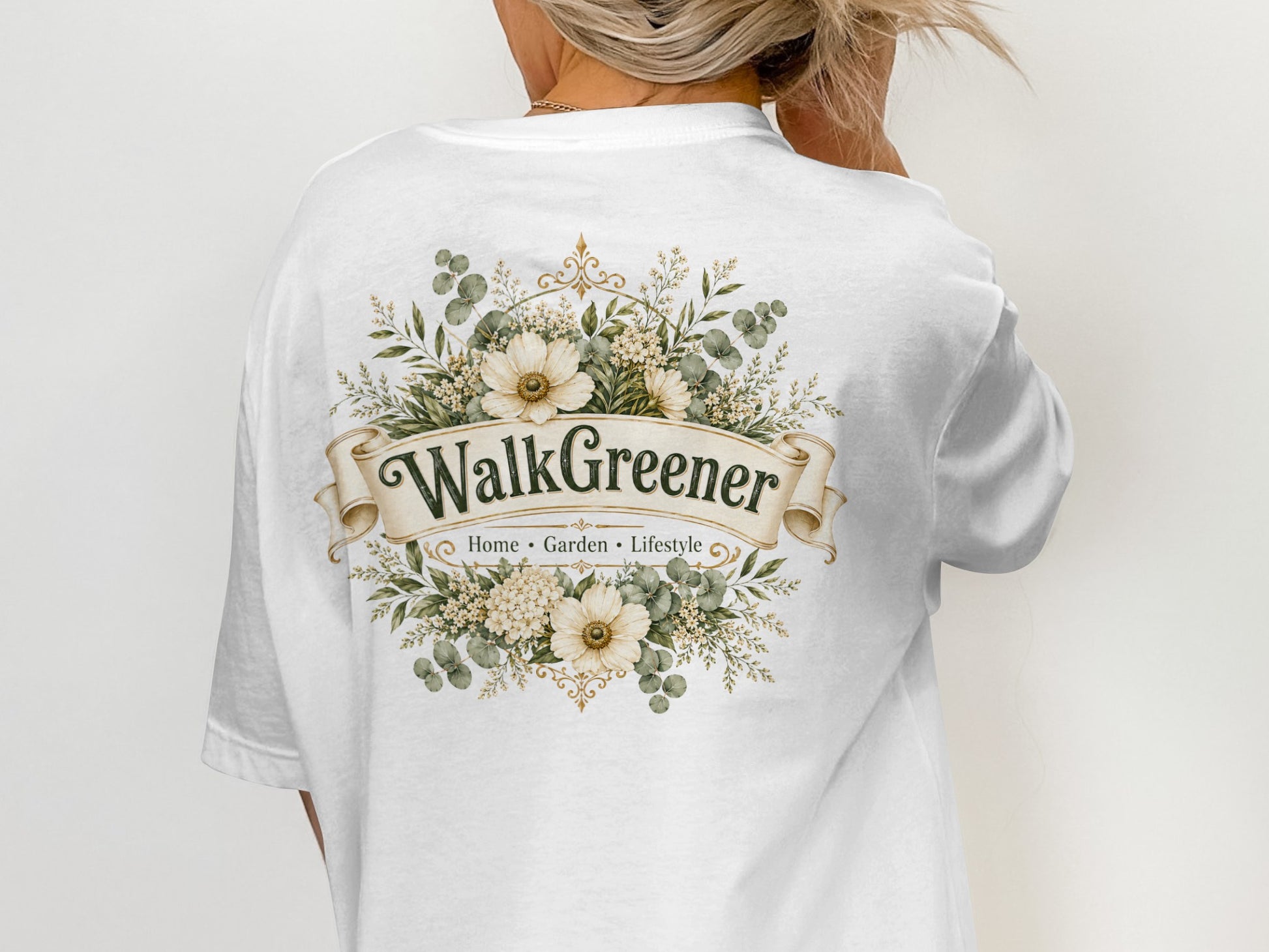 White t-shirt with a floral design and "WalkGreener Home Garden Lifestyle" text.