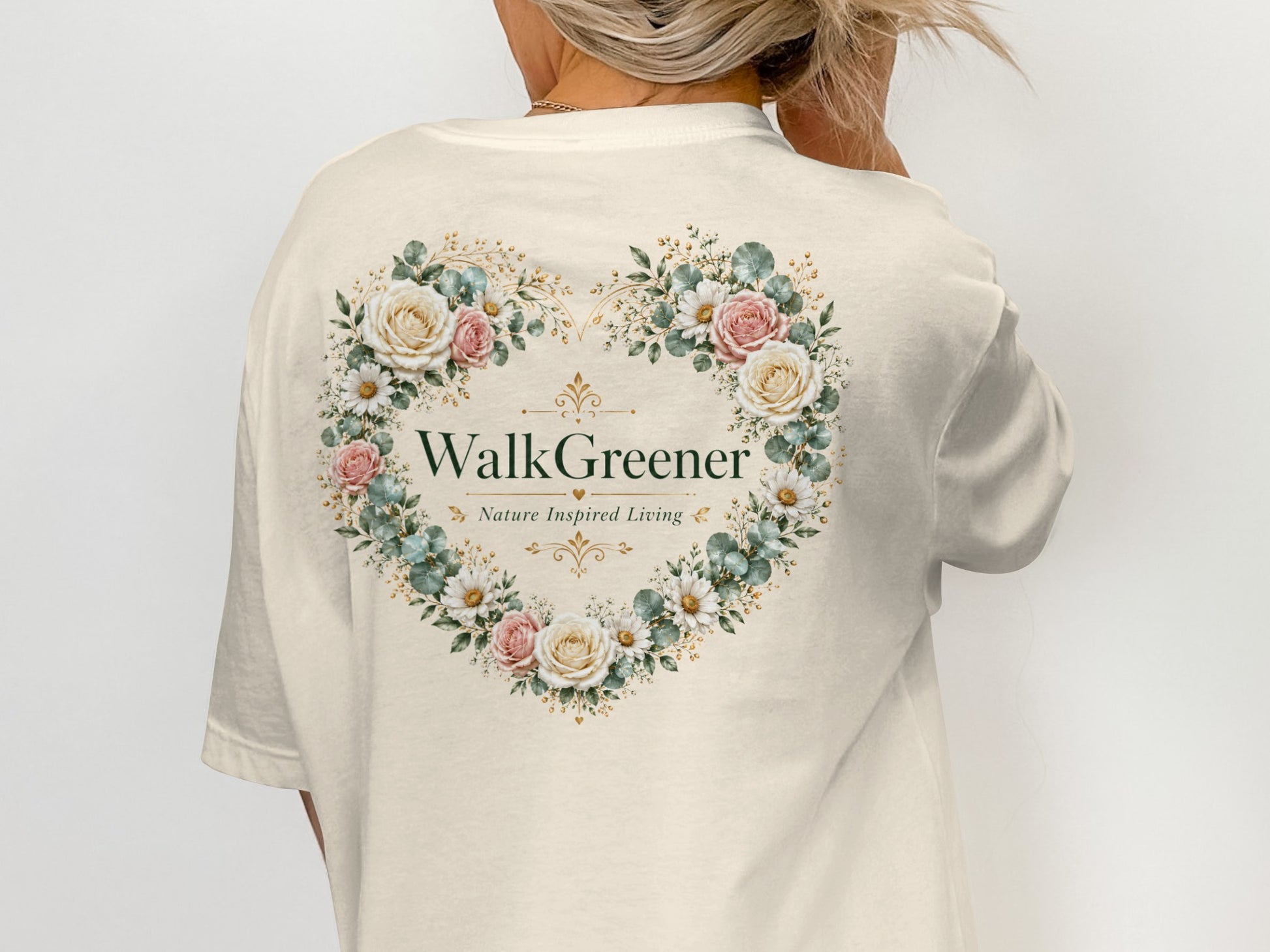 Cream t-shirt with a heart-shaped floral design and "WalkGreener Nature Inspired Living" text.