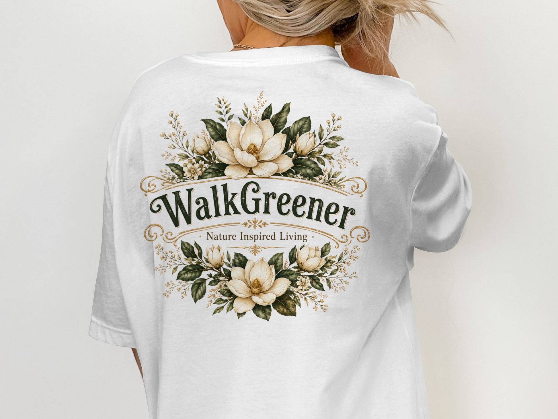 White t-shirt with "WalkGreener Nature Inspired Living" logo and floral design.