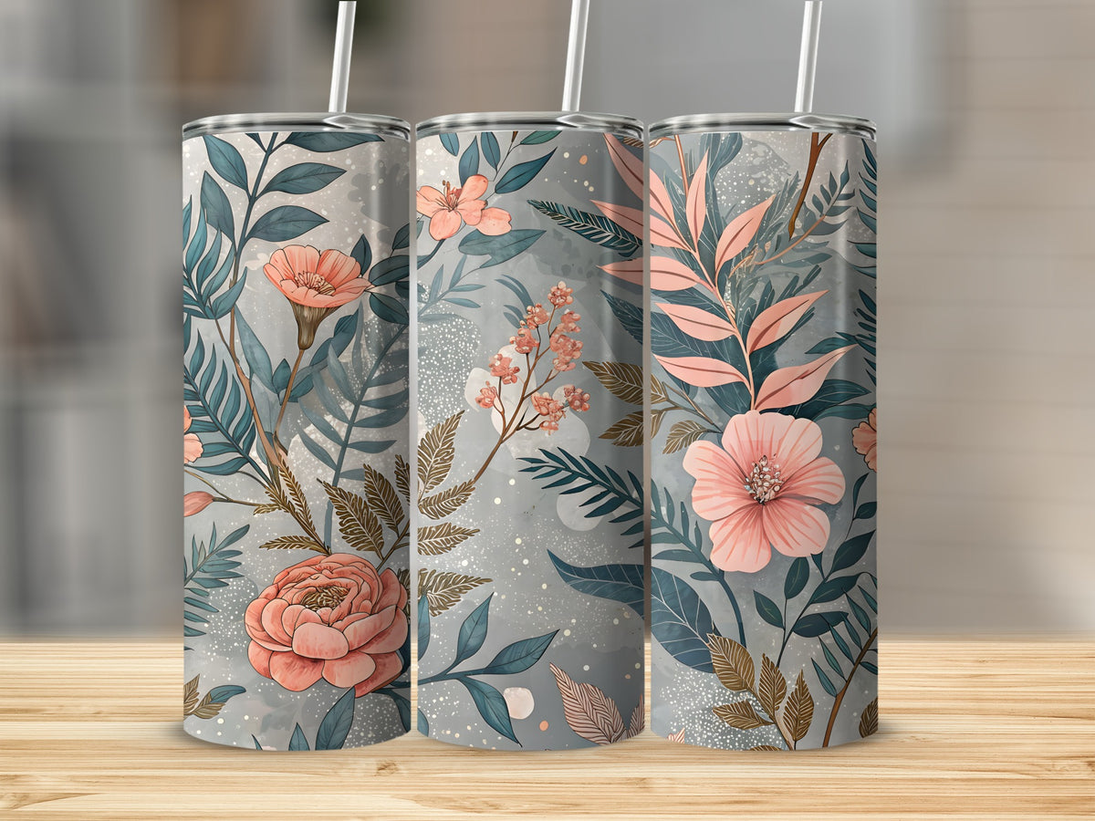 Close-up of the elegant pink and peach floral print with teal leaf accents wrapped around a 20oz stainless steel tumbler cup.