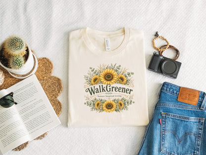 Cream t-shirt with "Walk Greener Nature Inspired Living" and sunflower graphic.