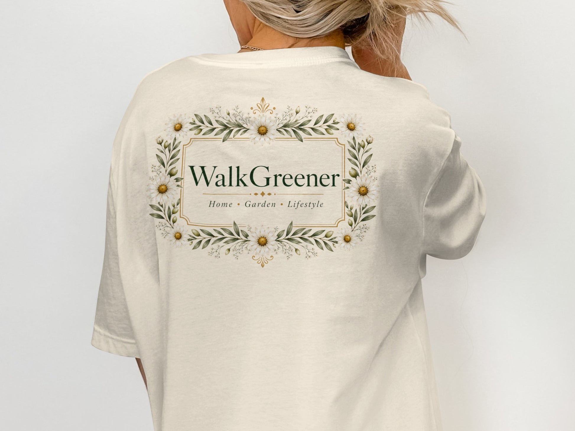 Cream t-shirt back with a floral frame and "WalkGreener Home Garden Lifestyle" text.