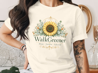 Cream t-shirt with WalkGreener logo featuring a sunflower and floral elements.