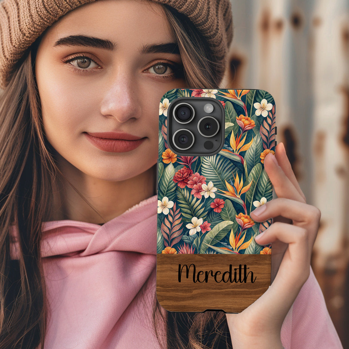 Tropical botanical custom name phone case held in hand, lifestyle shot.
