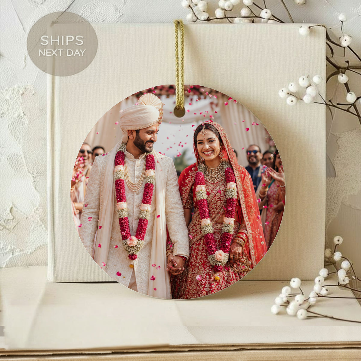 Couple in traditional Indian wedding attire with flower garlands, "SHIPS NEXT DAY" text.