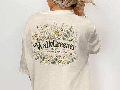 Cream t-shirt with oval floral design and text "WalkGreener Nature Inspired Living".