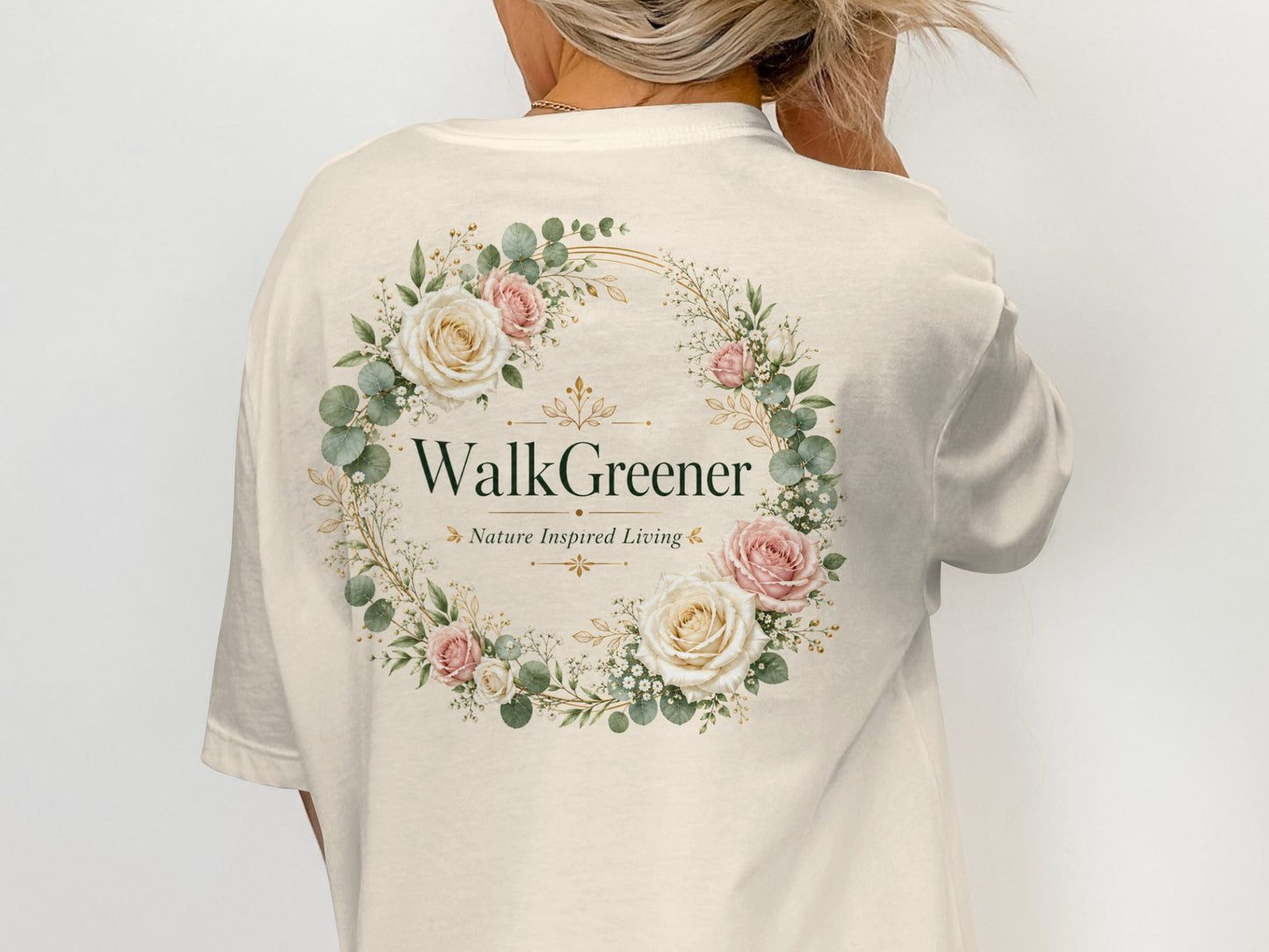 Cream t-shirt with floral wreath logo, "WalkGreener Nature Inspired Living".