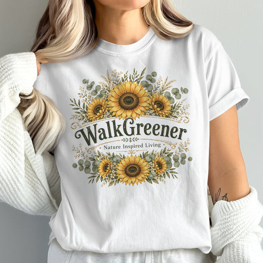White t-shirt with sunflowers and "Walk Greener Nature Inspired Living" text.