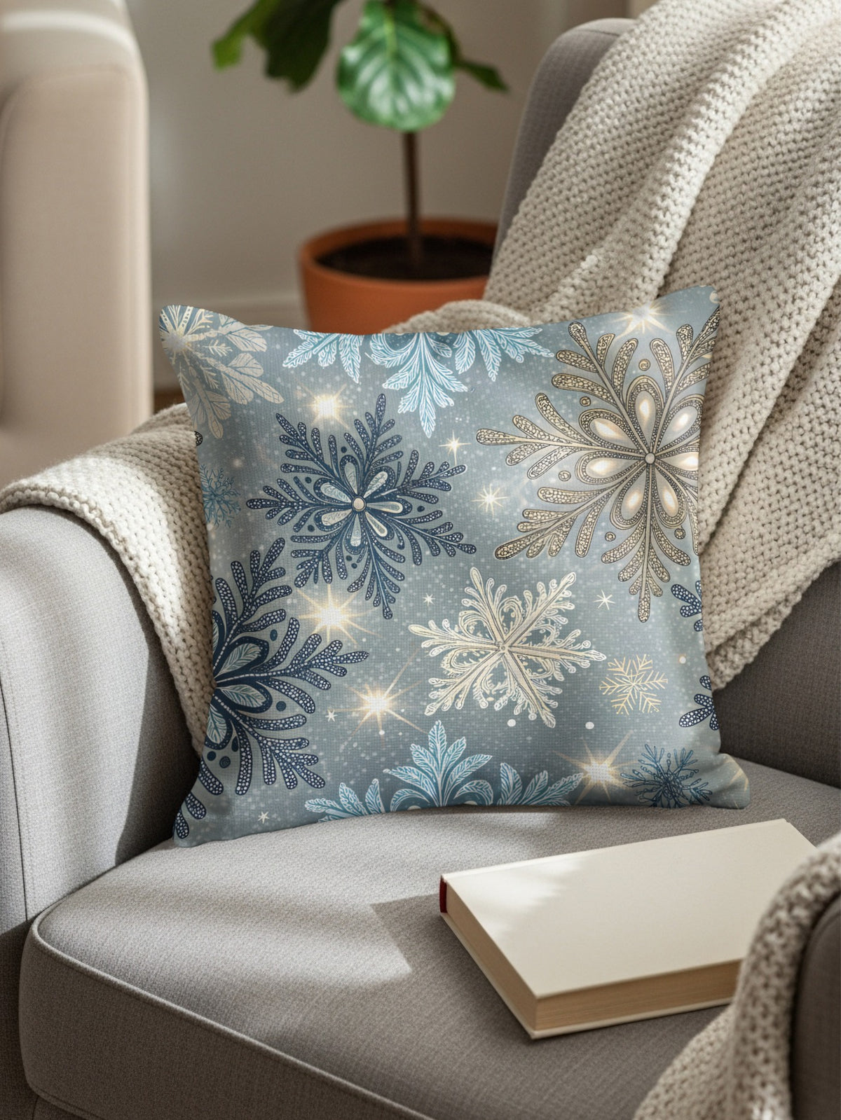 Square throw pillow with an elegant blue and white snowflake pattern featuring subtle sparkle detailing for winter decor