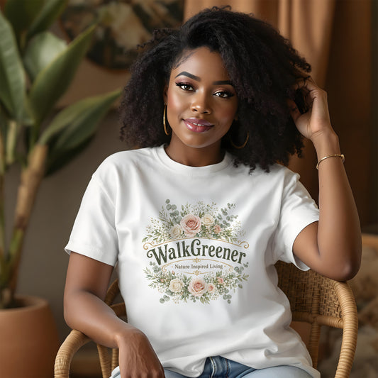 Woman wears white t-shirt with floral design and "WalkGreener Nature Inspired Living" text.