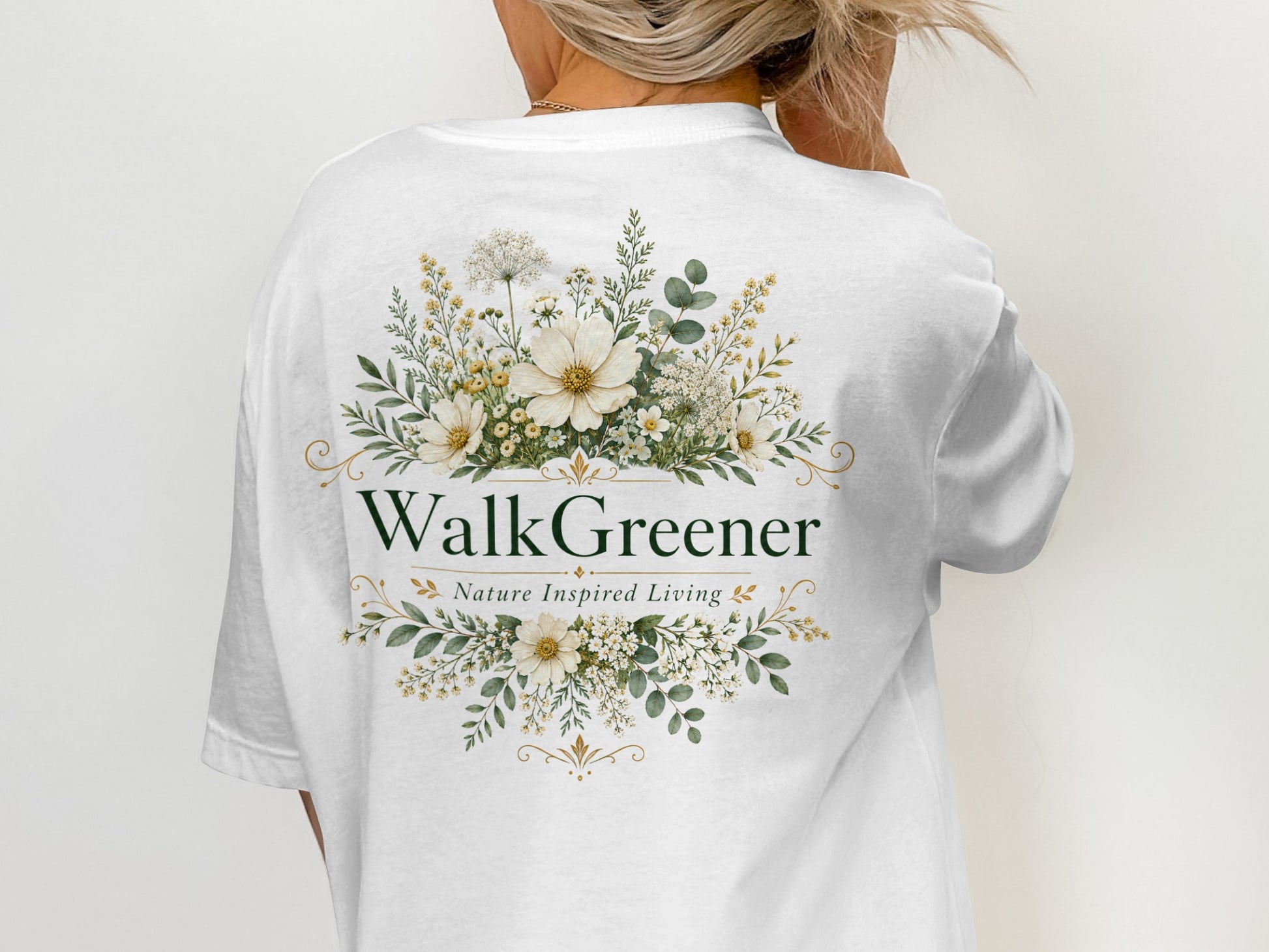 White t-shirt with "WalkGreener Nature Inspired Living" in green and floral design.