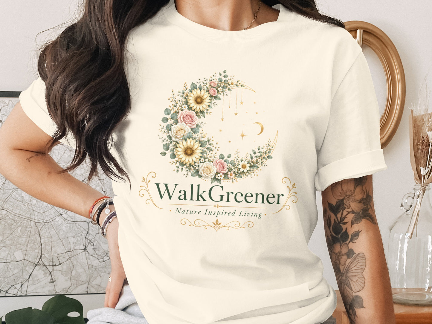 Cream t-shirt with "WalkGreener Nature Inspired Living" logo, featuring a floral crescent moon.