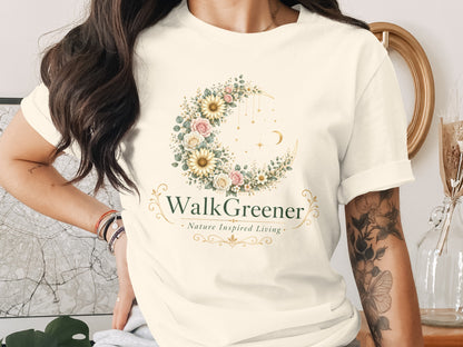 Cream t-shirt with "WalkGreener Nature Inspired Living" logo, featuring a floral crescent moon.