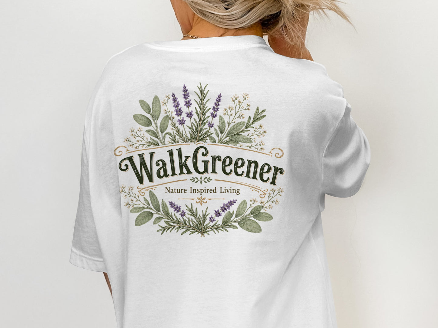 White t-shirt with "WalkGreener Nature Inspired Living" logo and floral design.