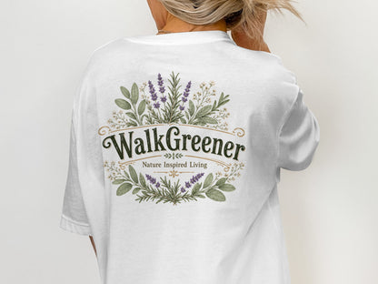 White t-shirt with "WalkGreener Nature Inspired Living" logo and floral design.