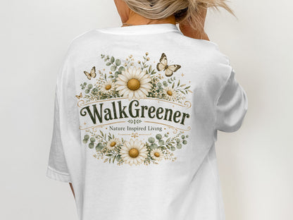 White t-shirt with "WalkGreener - Nature Inspired Living" design and floral accents.