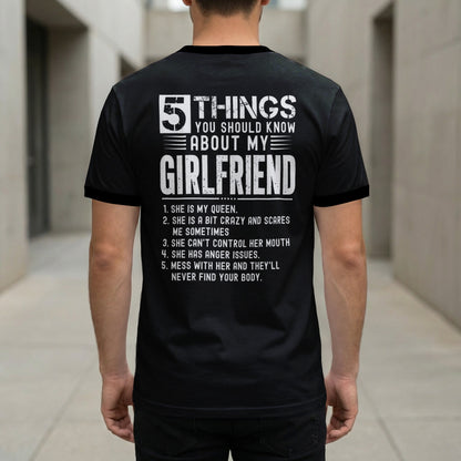 Black t-shirt with white text listing five things about a girlfriend.