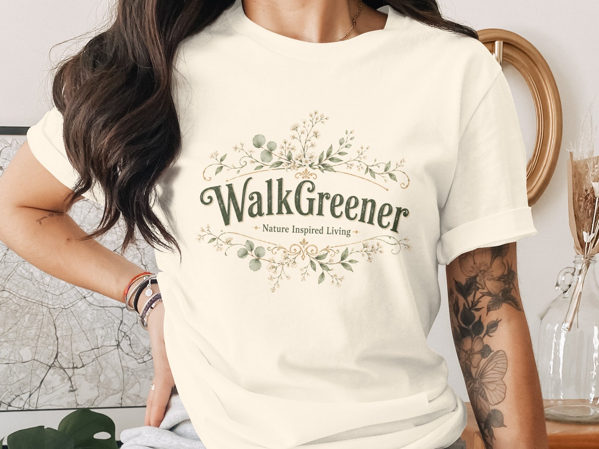Cream t-shirt with "WalkGreener Nature Inspired Living" text and floral design.