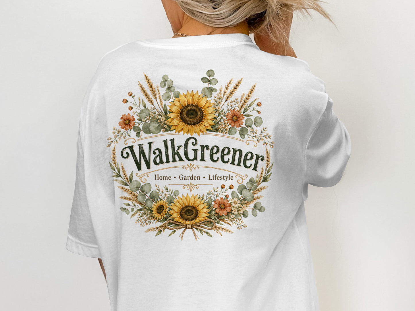 White t-shirt with floral wreath design and "WalkGreener Home Garden Lifestyle" text.