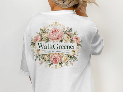 White t-shirt with floral design and "WalkGreener Nature Inspired Living" text.