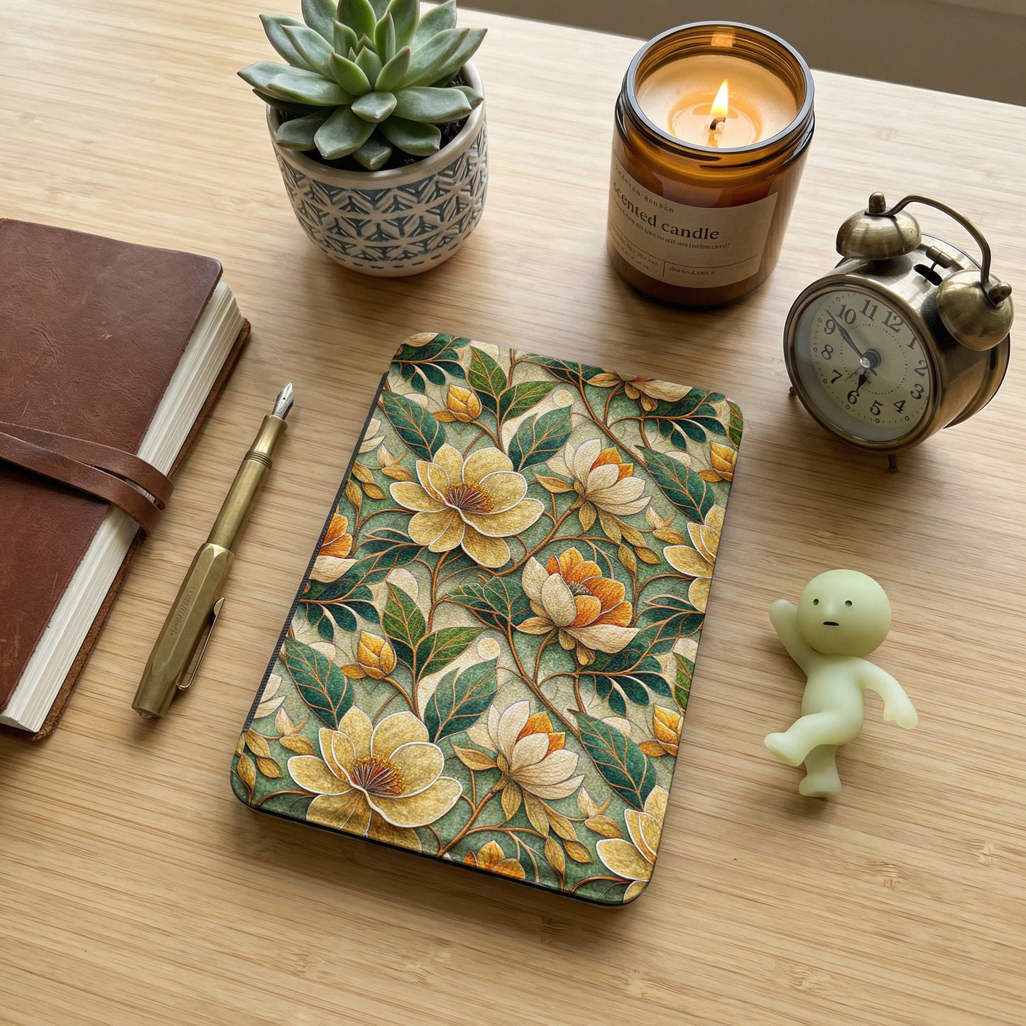 Floral Patterned Journal with Succulent and Candle Decor