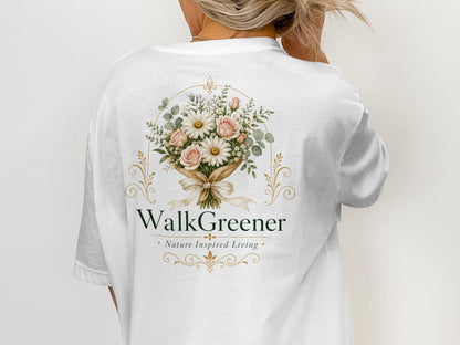 White t-shirt with a floral bouquet logo and "WalkGreener Nature Inspired Living" text.
