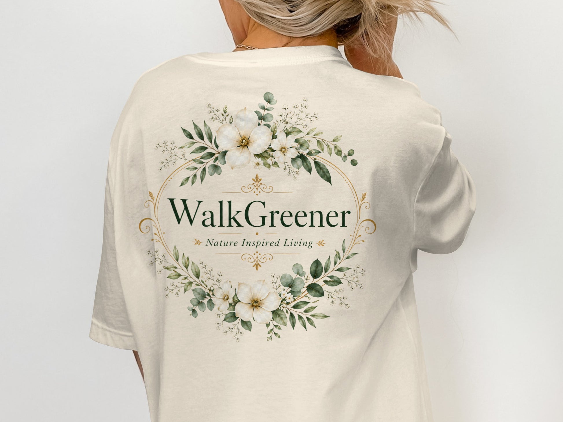 Cream t-shirt with "WalkGreener Nature Inspired Living" text and floral wreath.