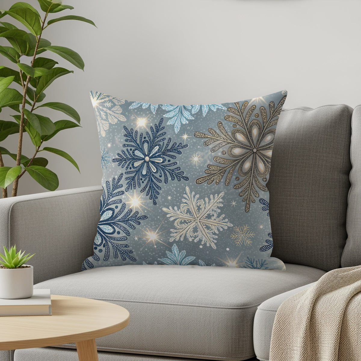 Winter snowflake throw pillow styled on a sofa with a cream knit throw