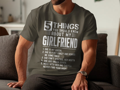 Olive green t-shirt with white text listing "5 Things You Should Know About My Girlfriend."