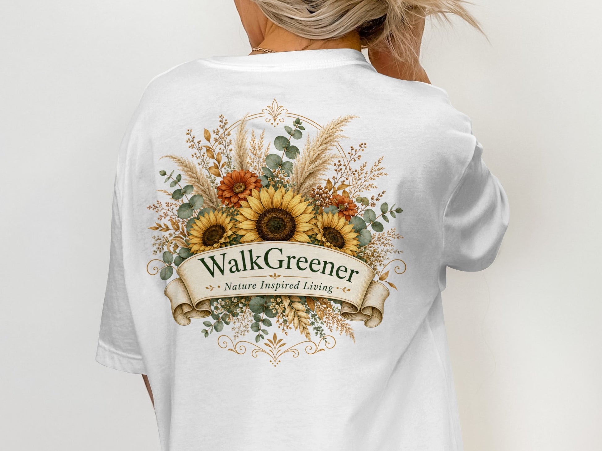 White t-shirt with sunflower and floral design, featuring "Walk Greener Nature Inspired Living" text.