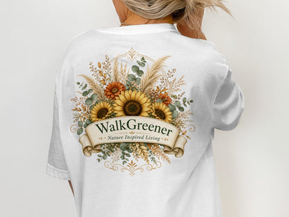 White t-shirt with sunflower and floral design, featuring "Walk Greener Nature Inspired Living" text.