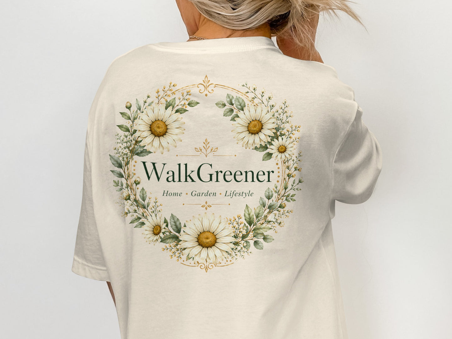 Cream t-shirt with "WalkGreener Home Garden Lifestyle" bordered by daisies and greenery.