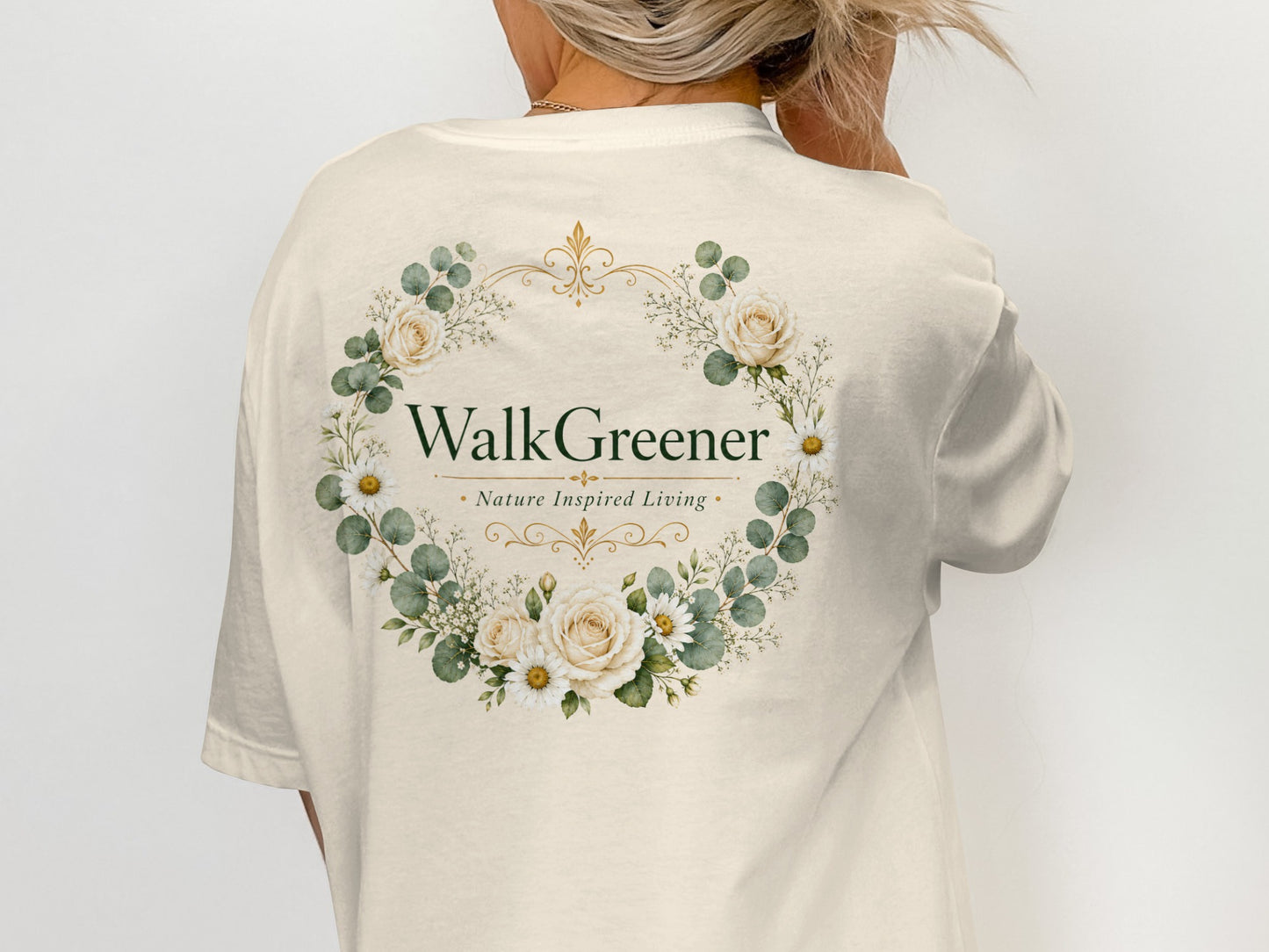 Cream t-shirt with floral wreath logo reading "WalkGreener Nature Inspired Living".