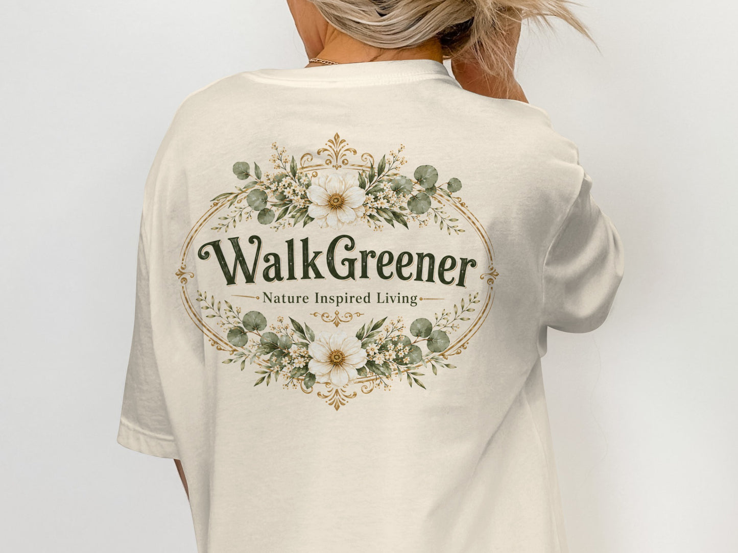 Cream t-shirt with "WalkGreener Nature Inspired Living" text and floral oval design.