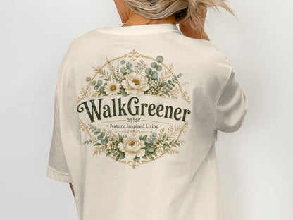Cream t-shirt with "WalkGreener Nature Inspired Living" floral design on back.