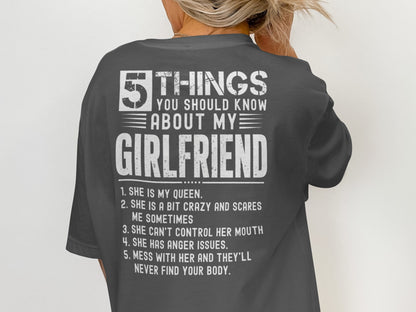 Dark grey t-shirt with white text: "5 THINGS YOU SHOULD KNOW ABOUT MY GIRLFRIEND".