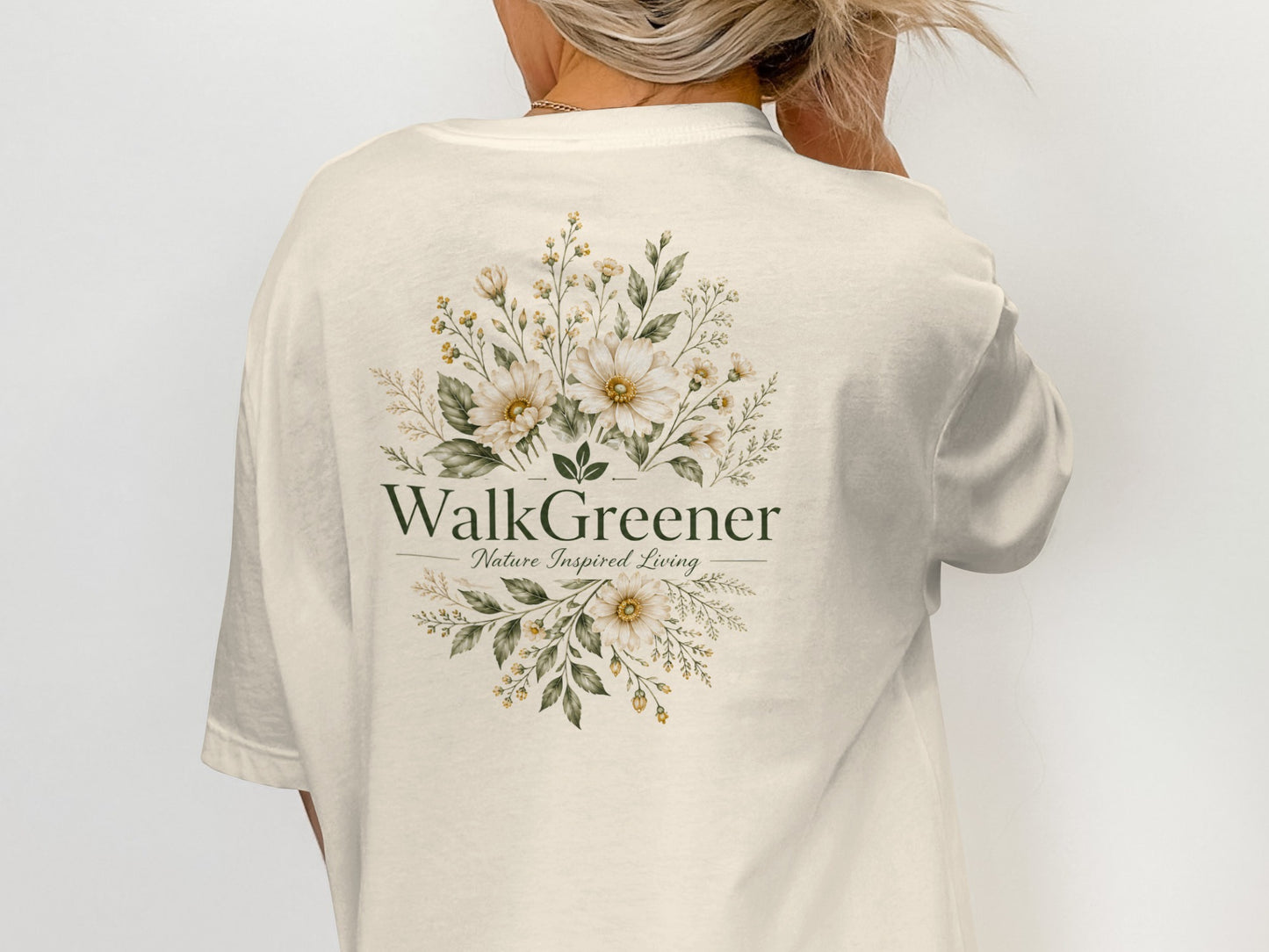 Cream t-shirt with floral design and text "WalkGreener Nature Inspired Living".
