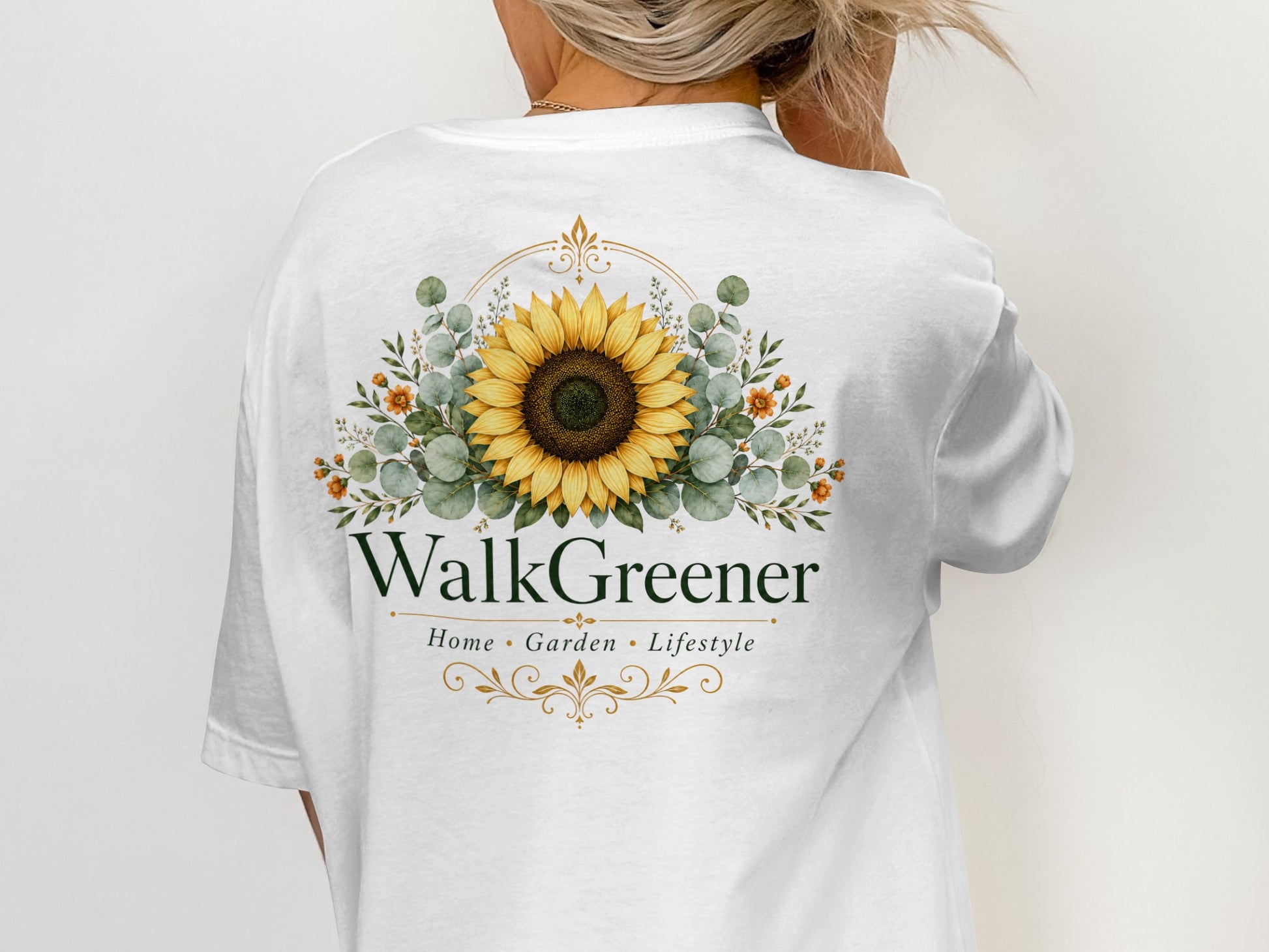 White t-shirt with floral sunflower graphic and "WalkGreener Home Garden Lifestyle" text.
