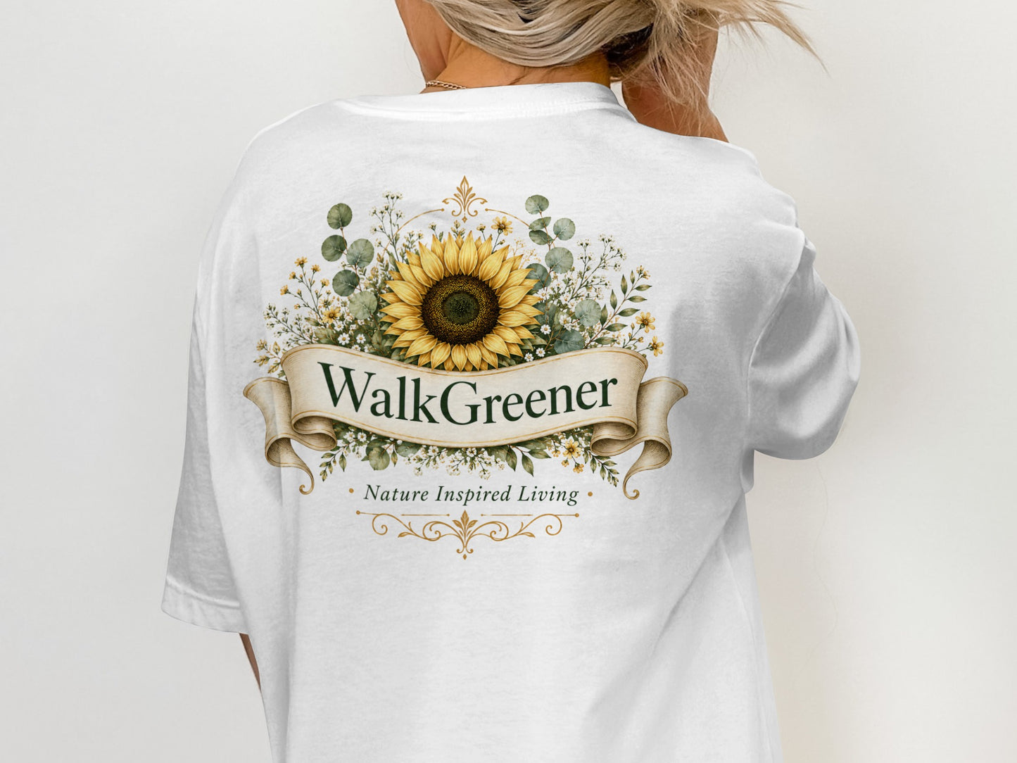 White t-shirt with "WalkGreener - Nature Inspired Living" and sunflower floral design.