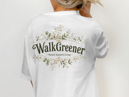 White t-shirt with "WalkGreener Nature Inspired Living" in green text and floral emblem.