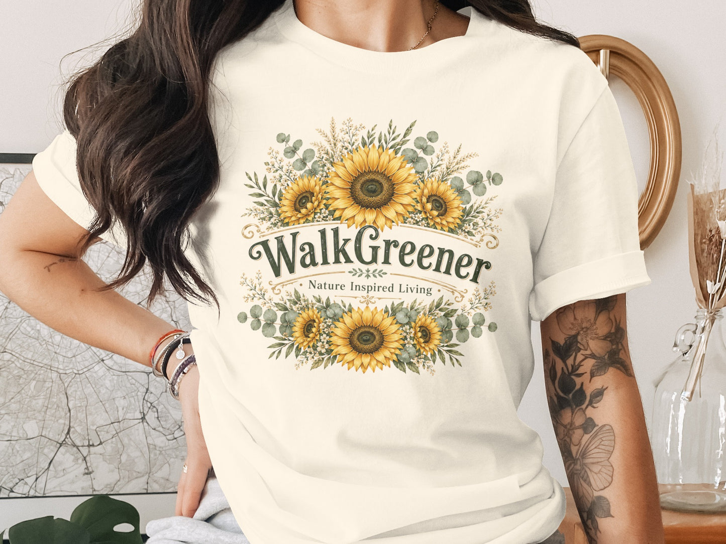 Cream t-shirt with "WalkGreener Nature Inspired Living" and a sunflower wreath design.